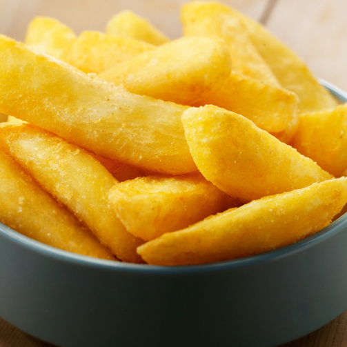 Signatures Gourmet chips in a blue bowl on wood table